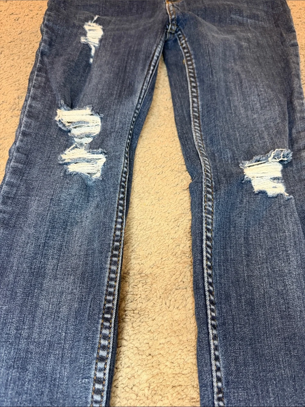 Free People indigo denim jeans with gold stitching
